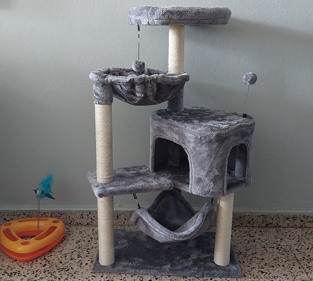 gray cat tree with white posts 