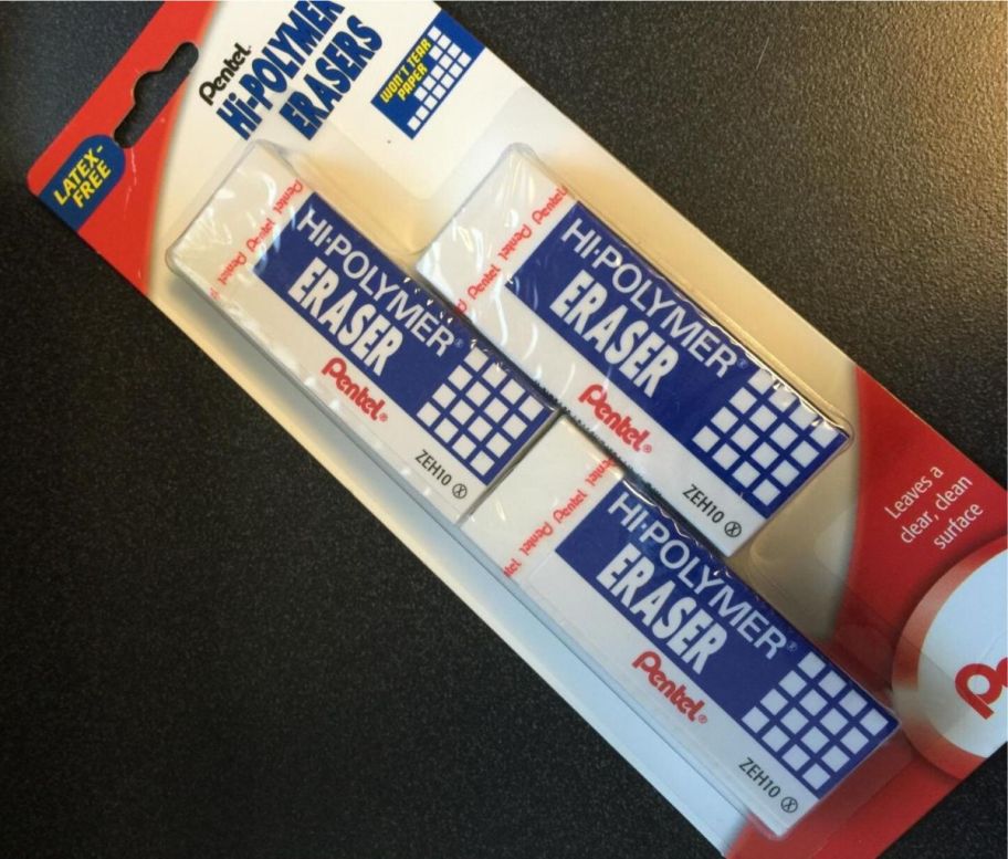 a 3 pack of oentel hi ploymer erasers on a desk