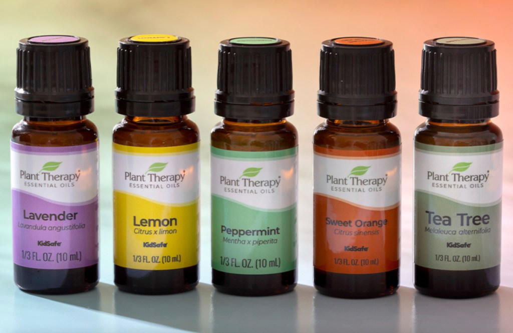 five essential oil bottles in a row