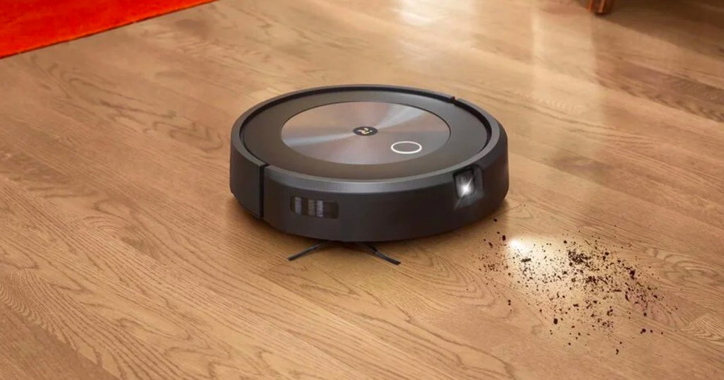 roomba vacuum cleaning up dirt off for hardwood floor