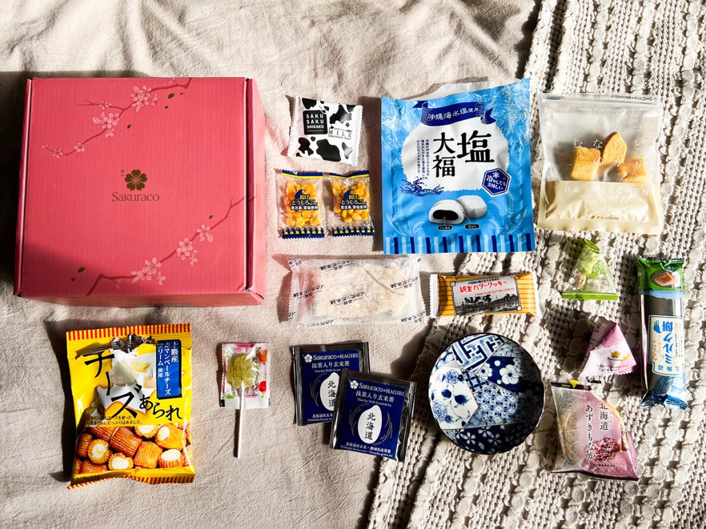 sakura japan box with all the food laid out next to it