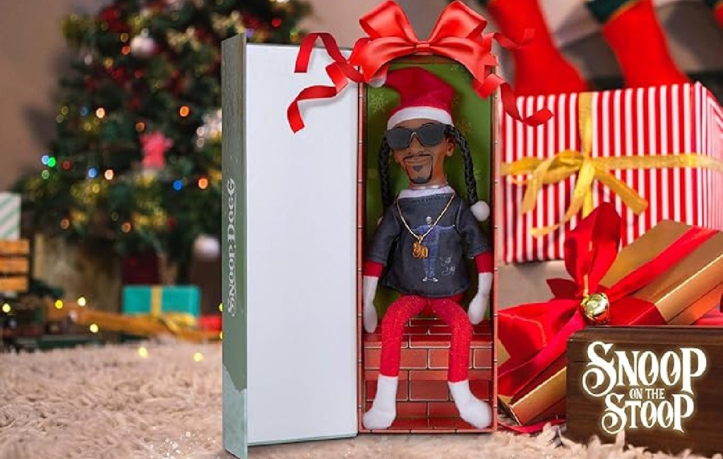 A Snoop dogg Snoop on the stoop doll in the box under a christmas tree