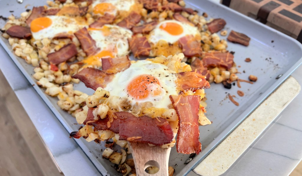 spatula with eggs bacon and potatoes