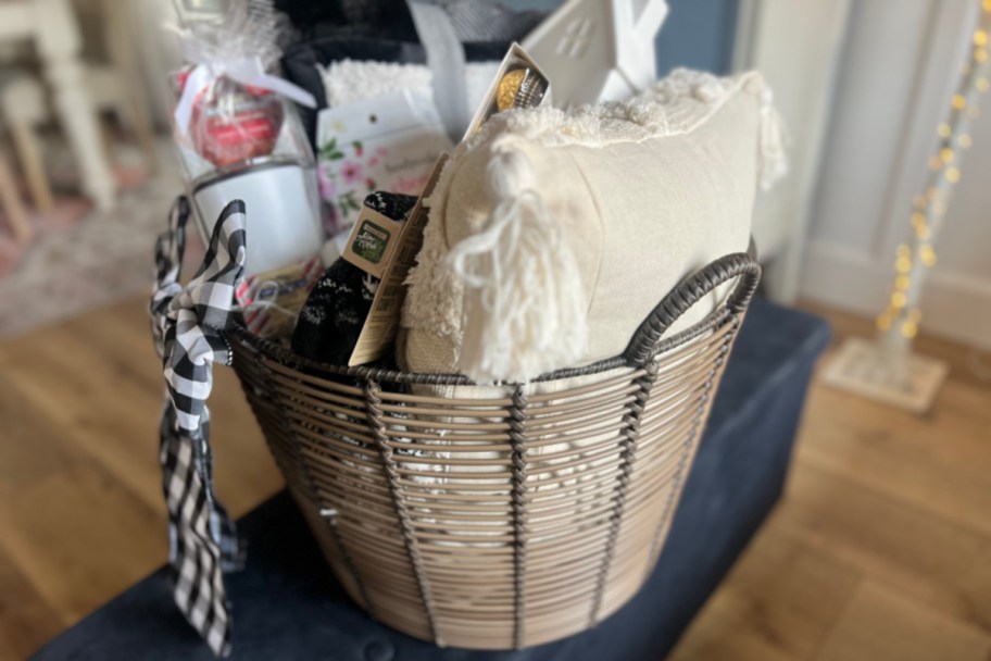 basket with pillow blankets and other cold weather items