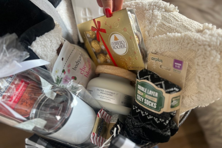 hand grabbing chocolate out of gift basket