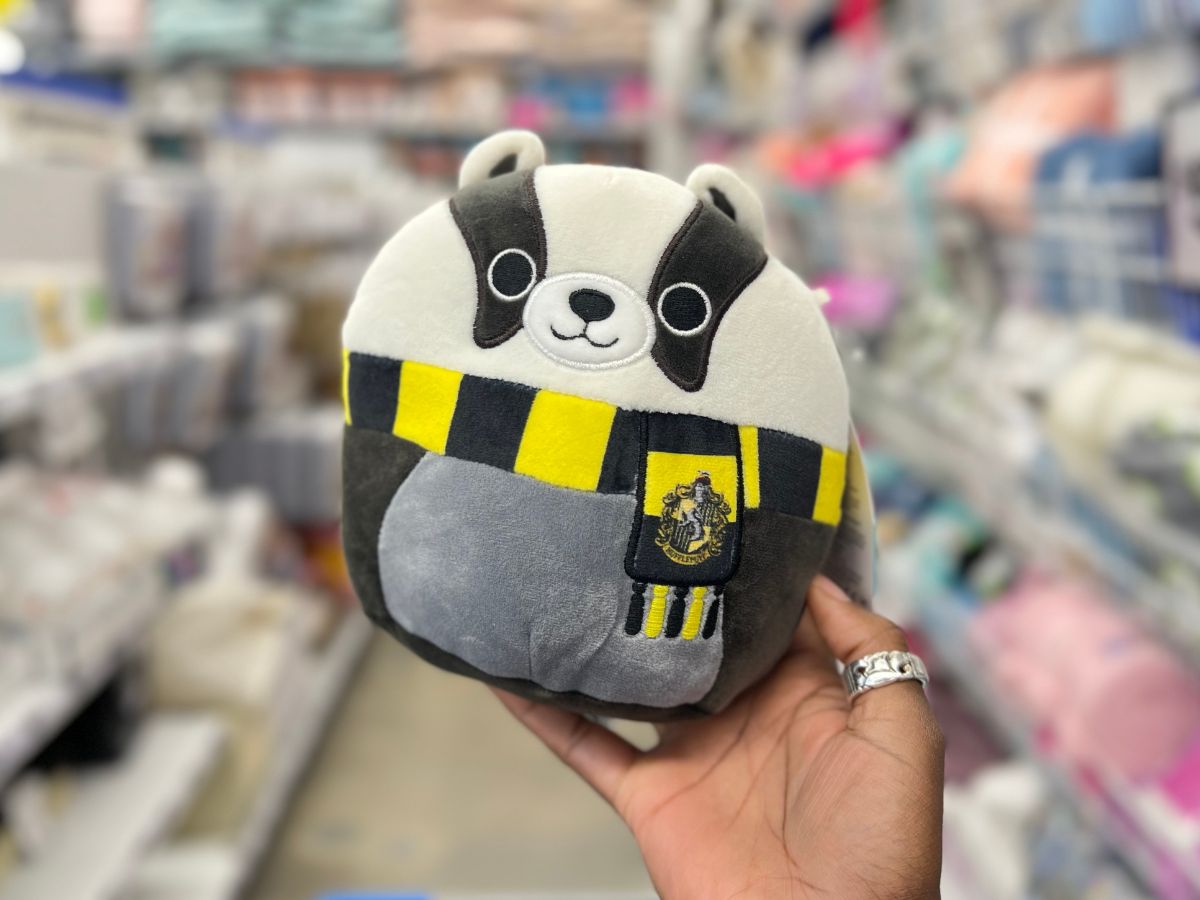 hand holding Harry Potter Squishmallow Hufflepuff Badger