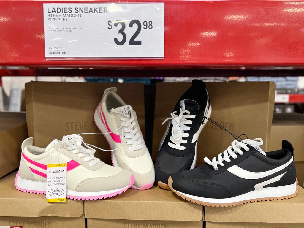 womens white and pink and black and white steve madden shoes sitting on boxes