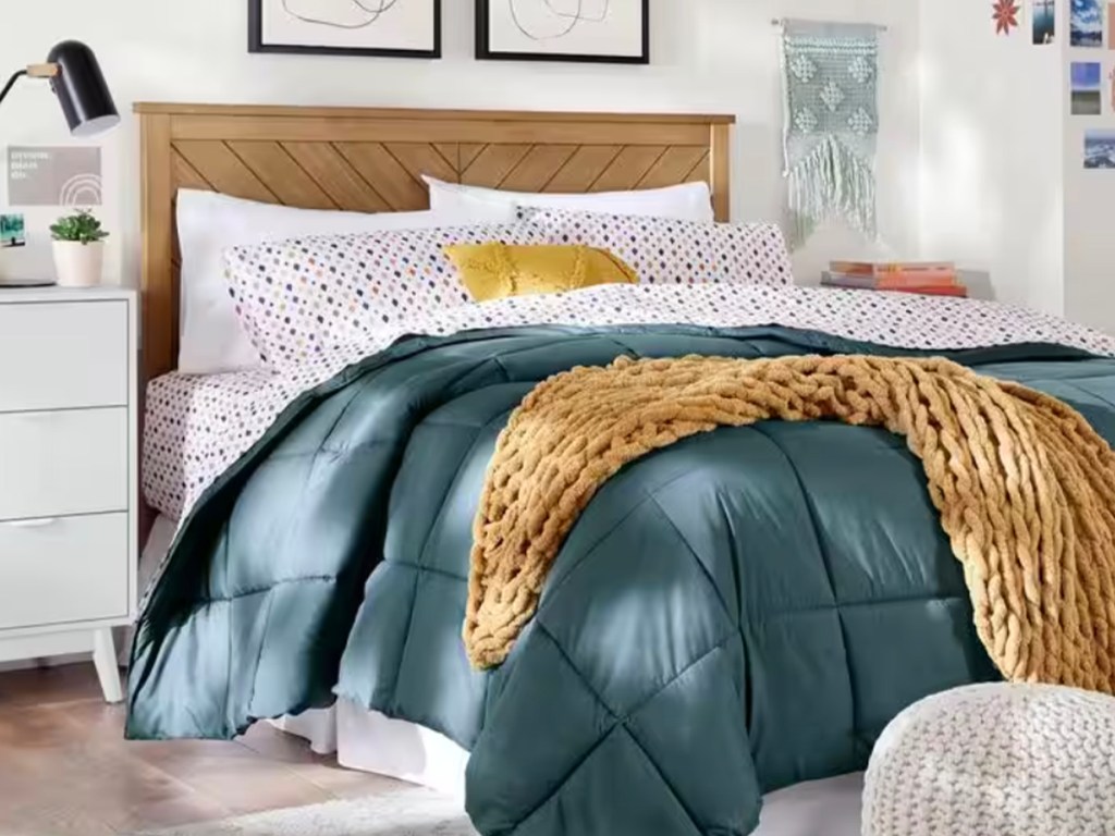 brown chevron headboard with green comforter in bedroom