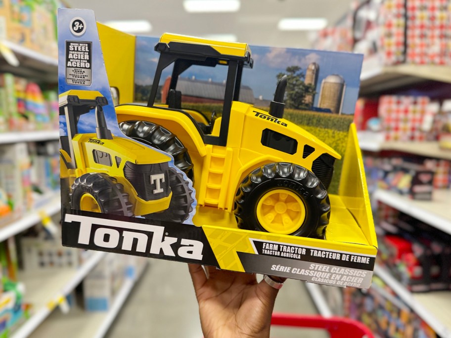 hand holding tonka truck toy