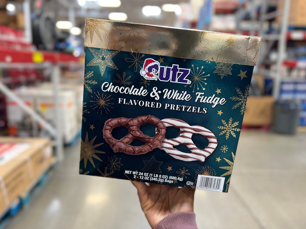 hand holding utz chocolate pretzels box