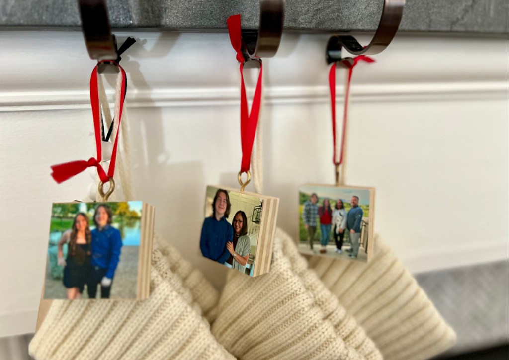 square photo ornaments with red ribbon on stocking hooks