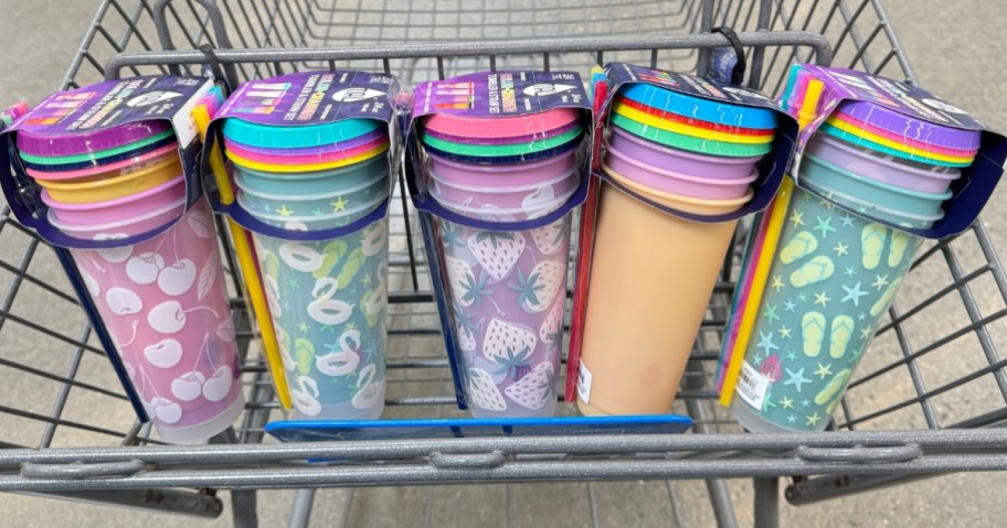 5 packs of colorful cups with lids and straws in a Walmart cart