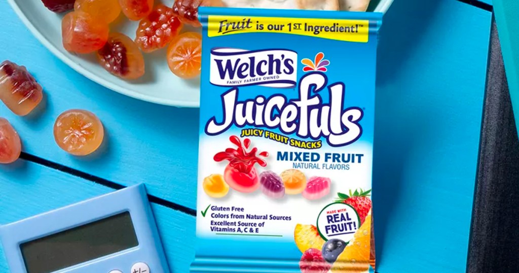 welch juicefuls snack bag on table next to fruit snacks and calculator