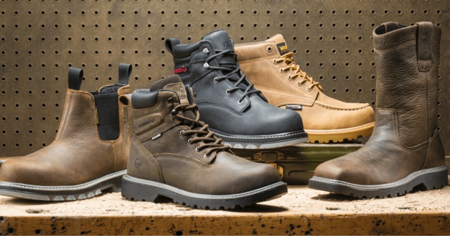 different colors and styles of Wolverine boots on a worktable