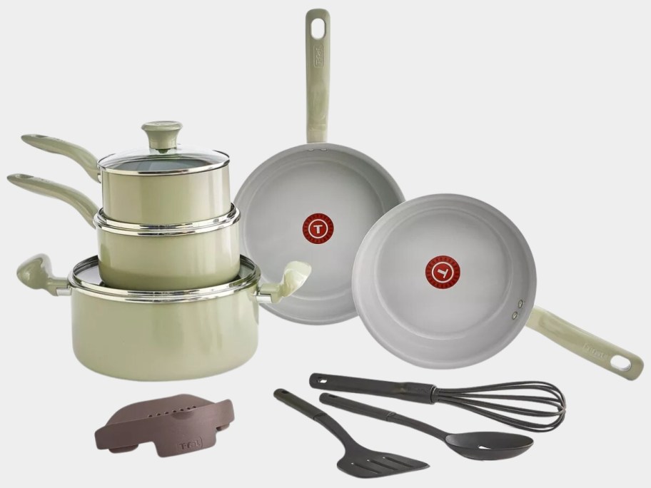 light cream T-fal cookware set with pots, pans, lids, and kitchen tools