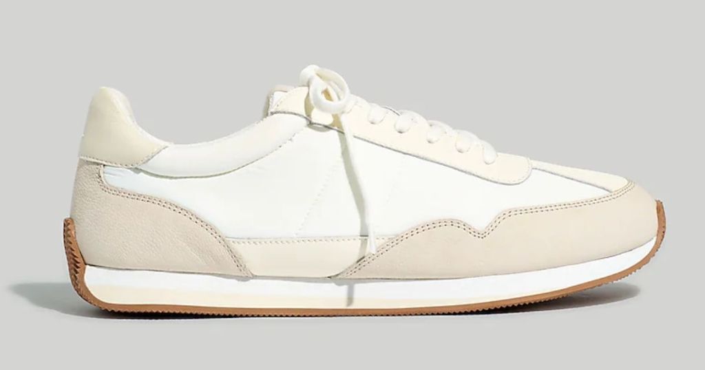 image of a single Madewell sneaker in white and cream