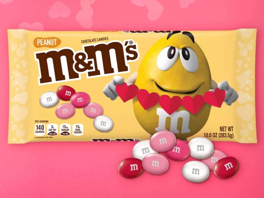 Valentine's Peanut M&M's bag with individual peanut M&M's laying around it