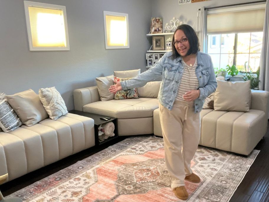 Woman showing off her 25home sectional