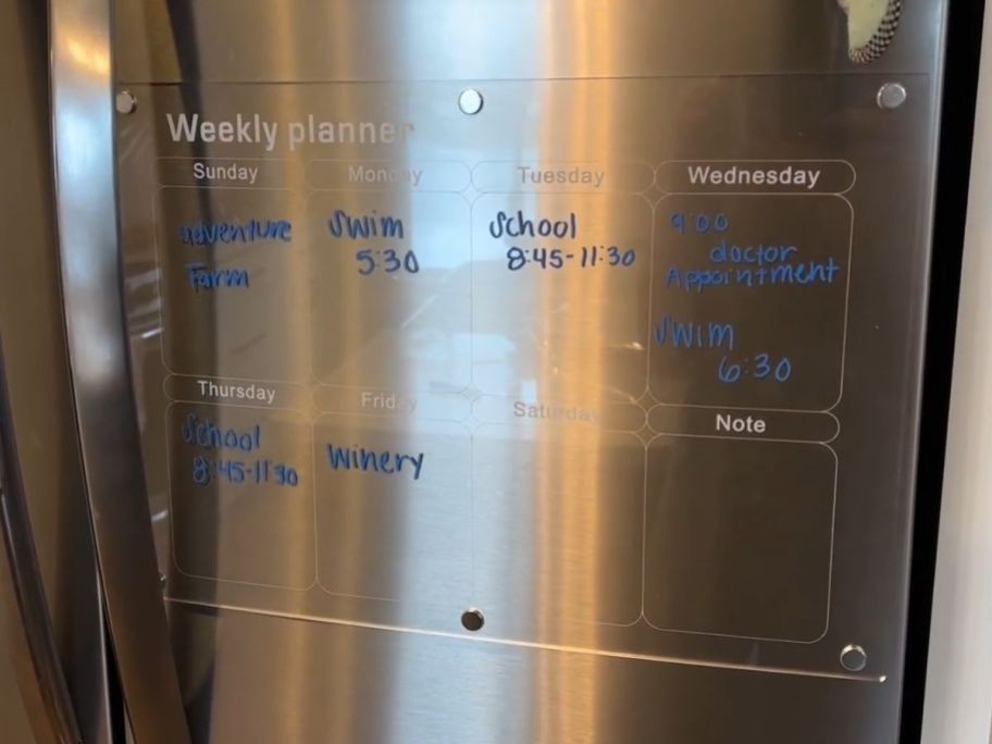 weekly acrylic calendar on fridge with menu plan