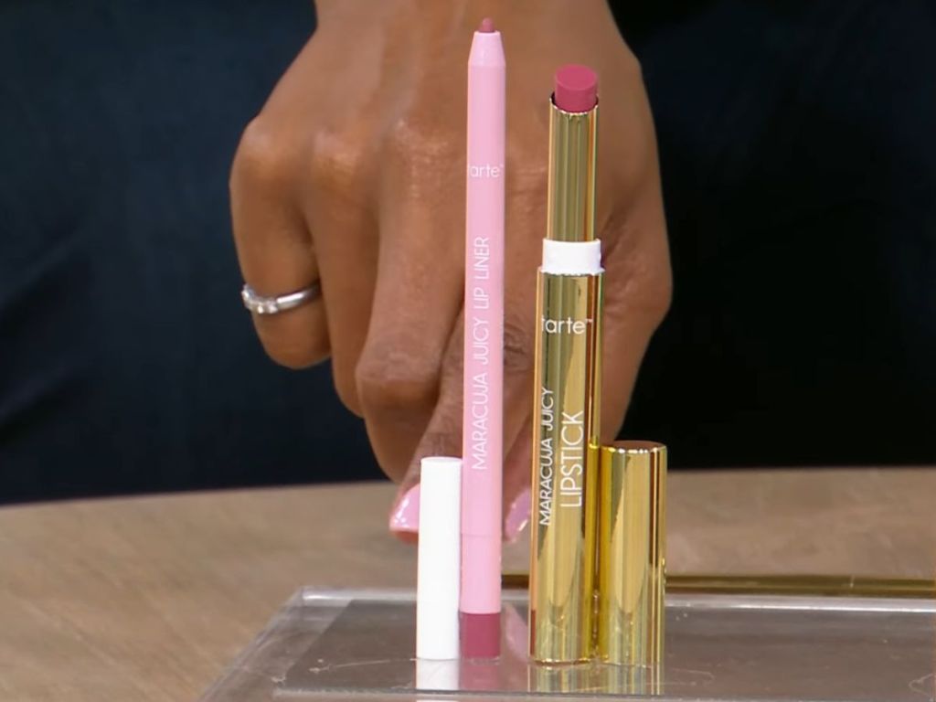 Tarte Maracuja lip liner and lipstick on display with person's hand behind them
