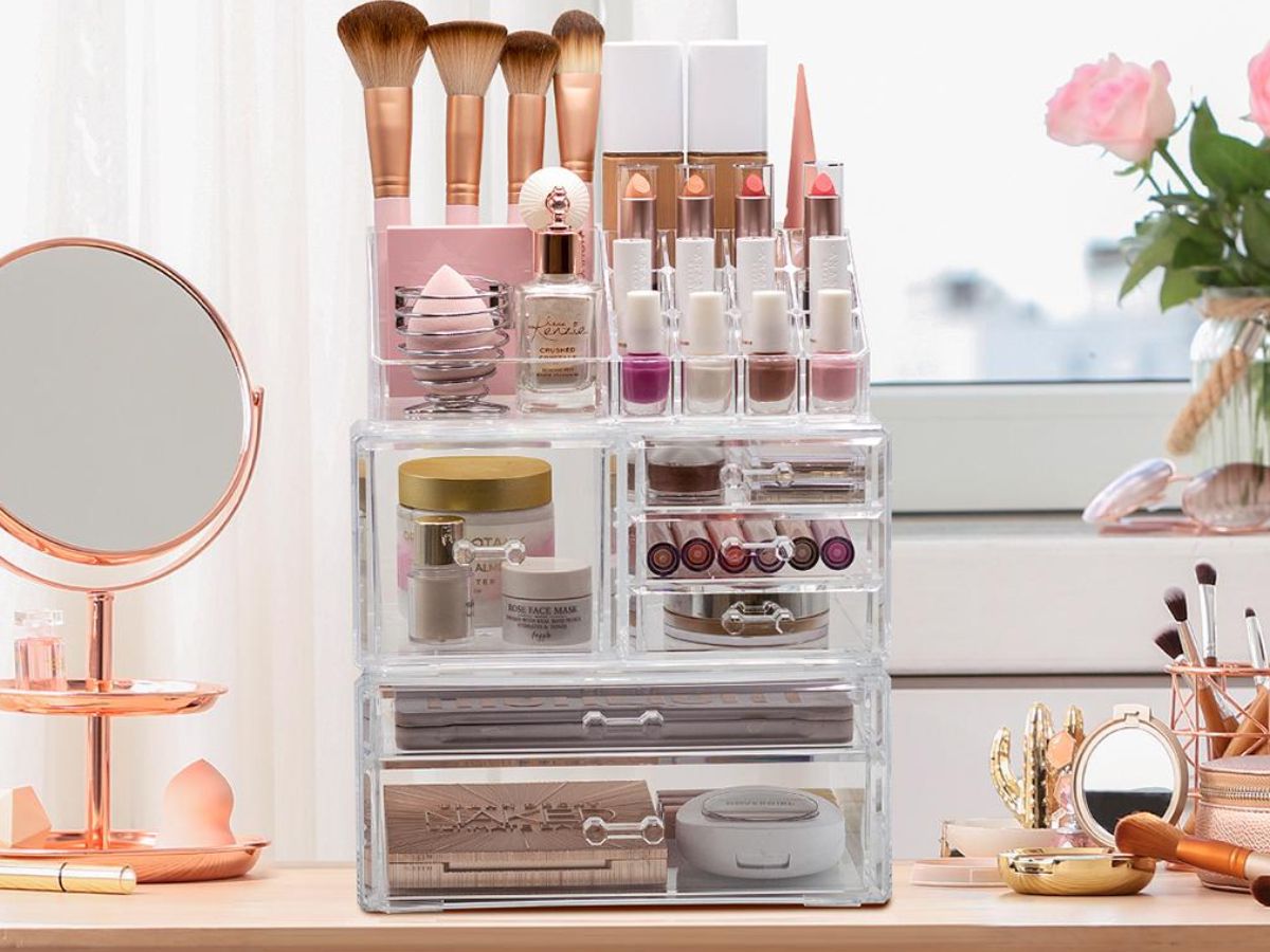 large 3 piece clear acrylic makeup organize set with makeup in it sitting on vanity