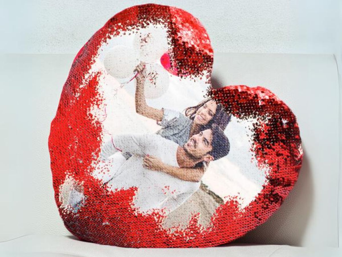 heart shaped sequin pillow with photo of couple