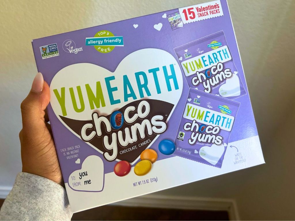 hand holding box of Yum Earth Valentine's Choco Yums