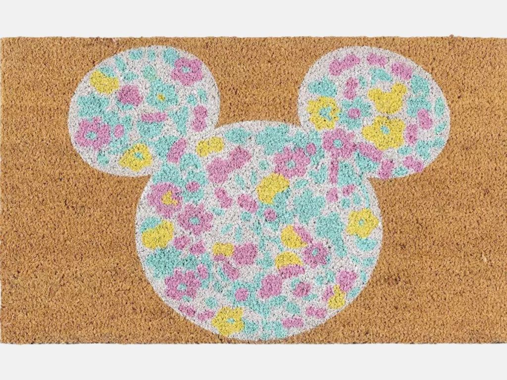 coir doormat with Mickey Mouse head on it with colorful flowers