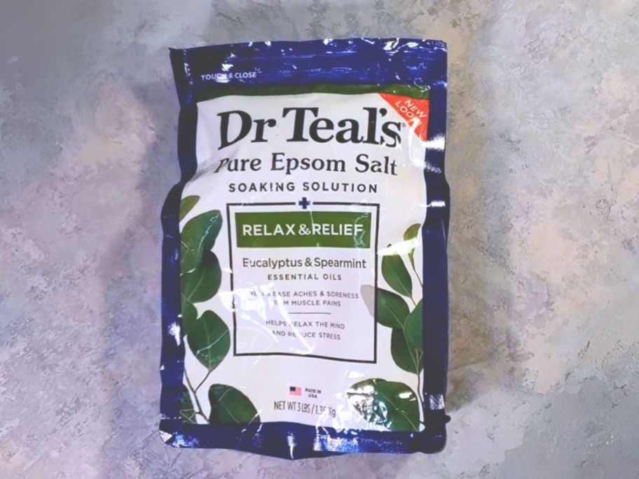 large bag of Dr Teal's Salt Soak with Pure Epsom Salt, Relax & Relief with Eucalyptus & Spearmint laying on counter