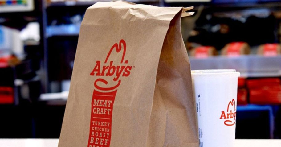 An Arby's bag and Drink