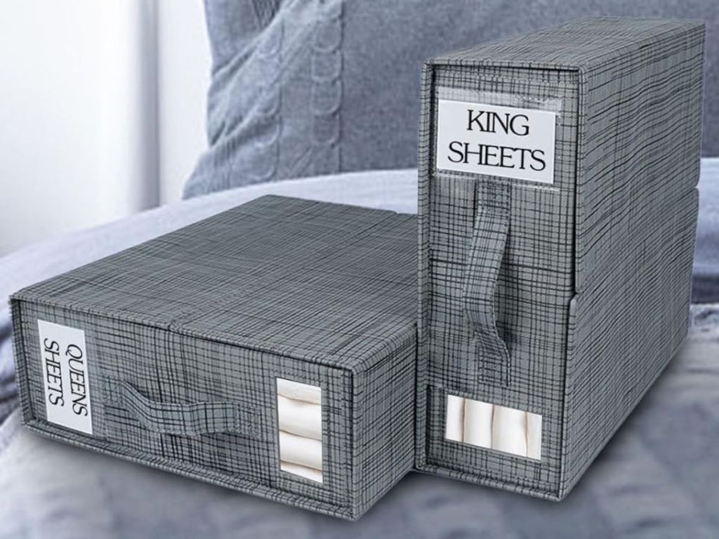 Two Sheet Organizer Cubes on a bed