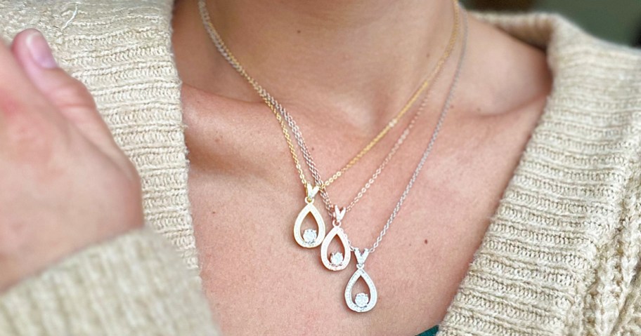 woman wearing 3 teardrop necklaces in gold, white gold, and rose gold finishes