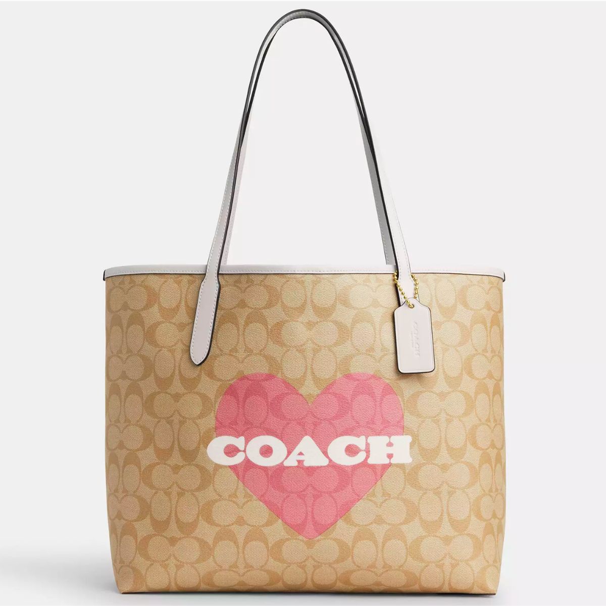 a large khaki tote with a big pink heart on it