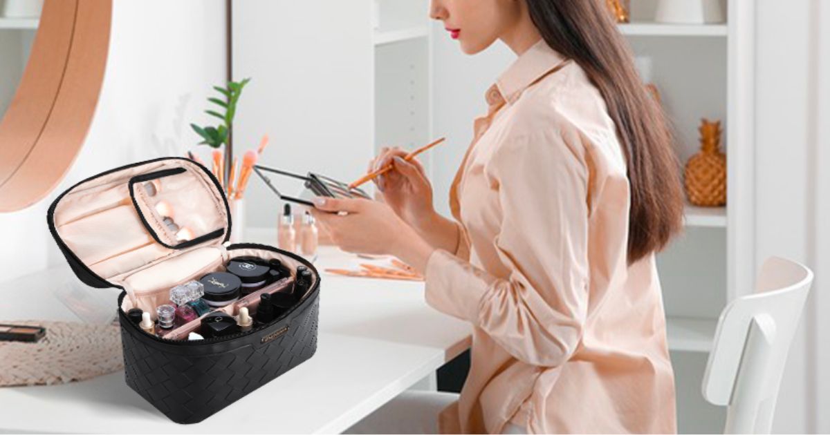 a woman getting ready infront of a mirror with a black Travel Cosmetic Bag next to her on the counter