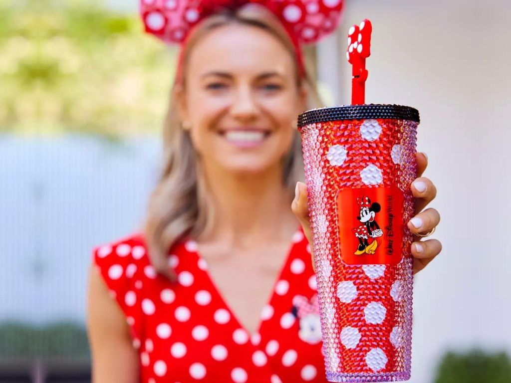 Woman holding a Disney Minnie Mouse Starbucks Tumbler