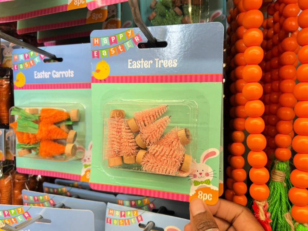 Packages of mini Easter trees, hanging on store shelf at dollar tree