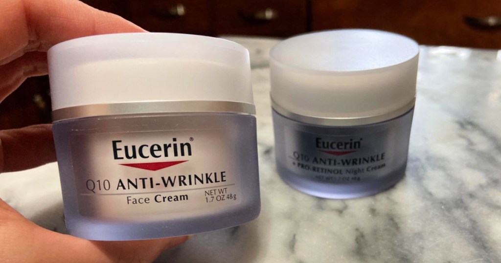 person holding up container of Eucerin Q10 Anti Wrinkle Skin Care Set
