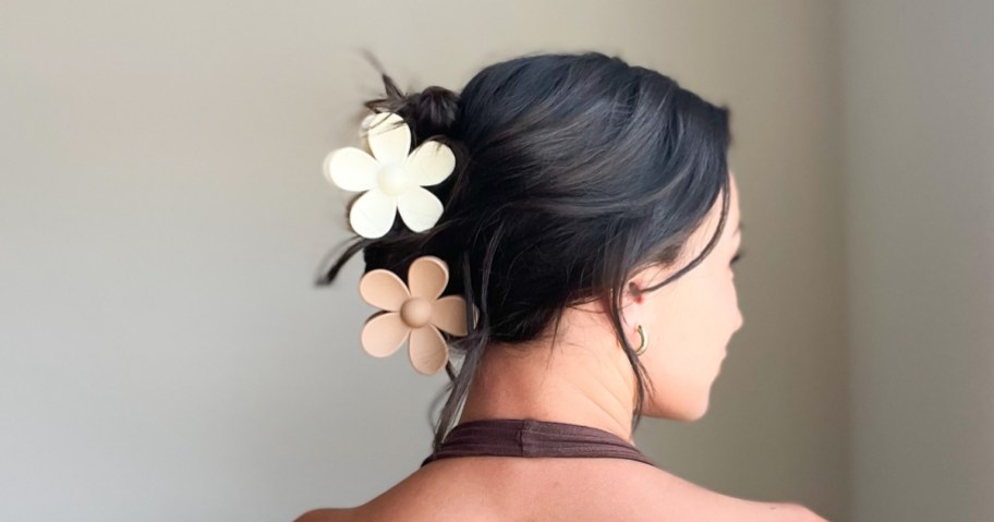 woman wearing 2 flower claw clips in hair