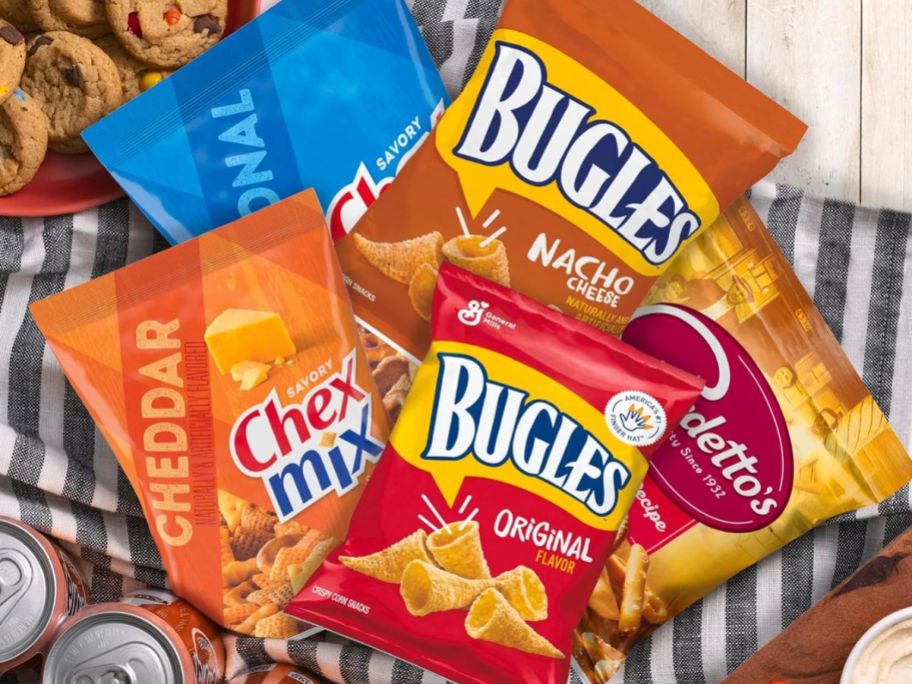 Bags of snacks including Bugles in original and nacho cheese, original and cheddar Chex Mix and Gardetto Snack Mix.