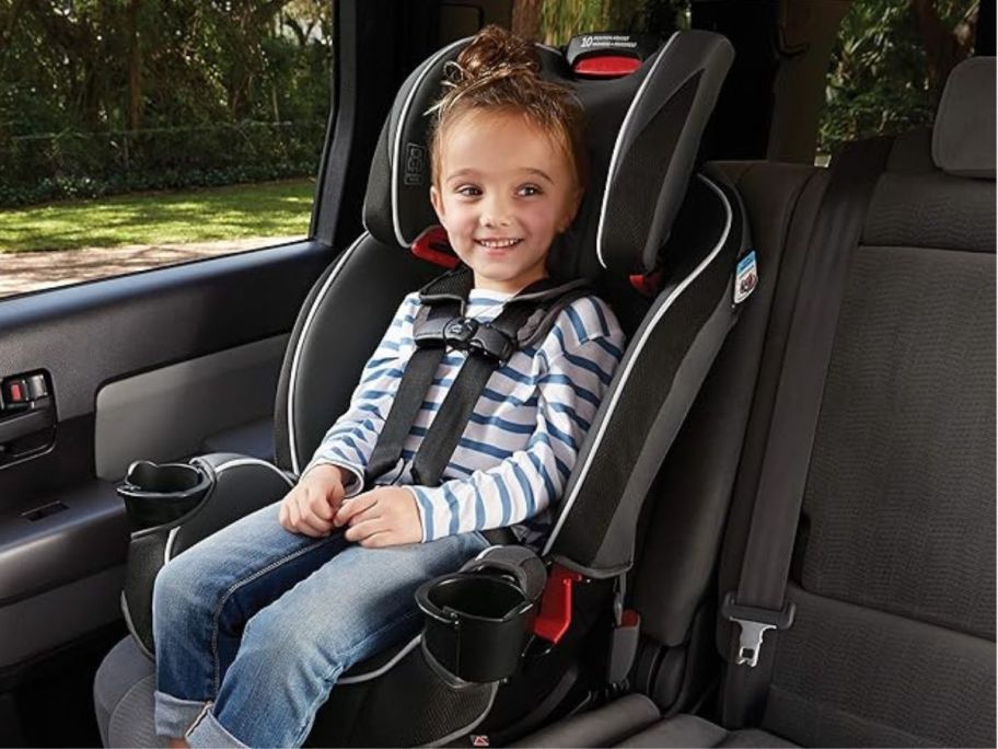 Graco SlimFit 3-in-1 Convertible Car Seat in car with girl in it