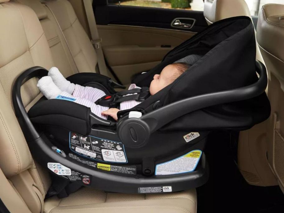 Graco SnugRide SnugFit 35 Infant Car Seat w/ Anti-Rebound Bar in car with baby in it