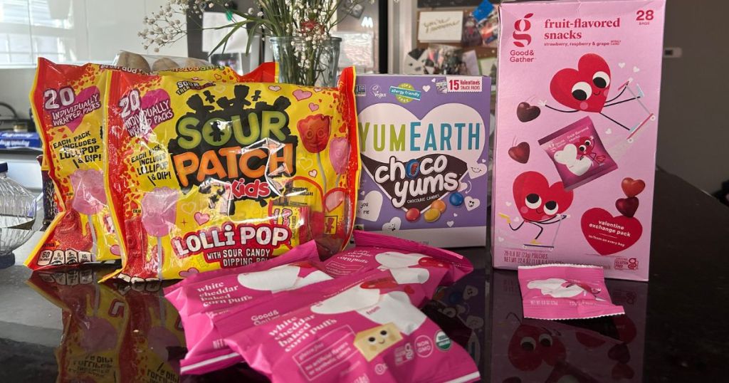 Sour Patch Kids, YumEarth Choco Yummi's and Good & Gather Valentine's Candy on kitchen counter