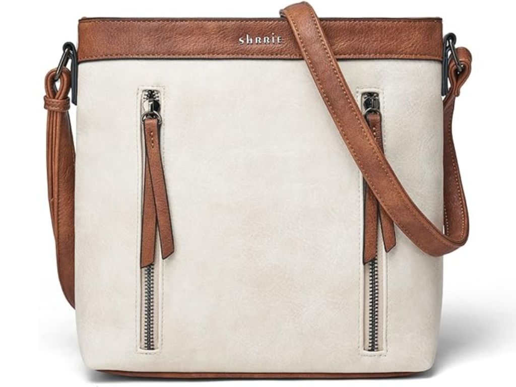 beige faux leather crossbody bag with tan strap and accents