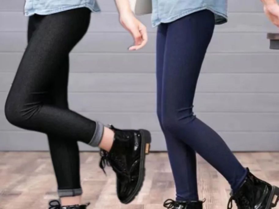 2 girls wearing black and jean color jean leggings and boots
