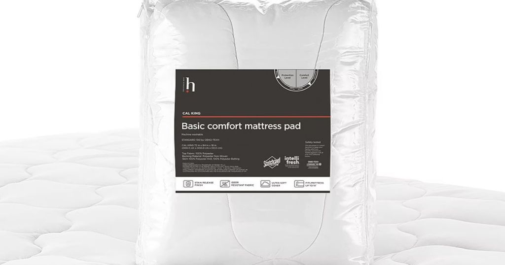 mattress pad in package sitting on top of a mattress with the pad on it