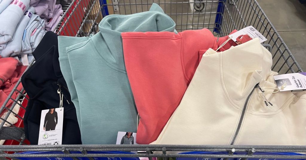 women's black, green, pink and white pullovers and pants in cart at Sam's Club