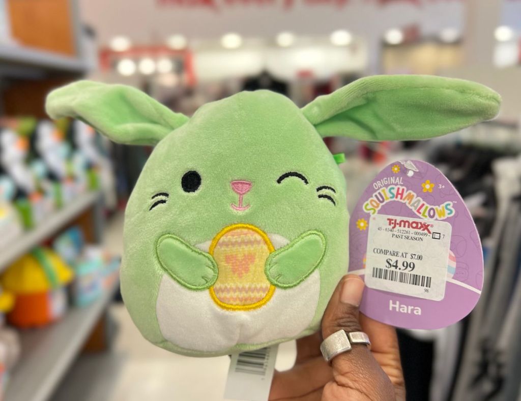 a womans hand holding a Hara bunny easter squishmallows