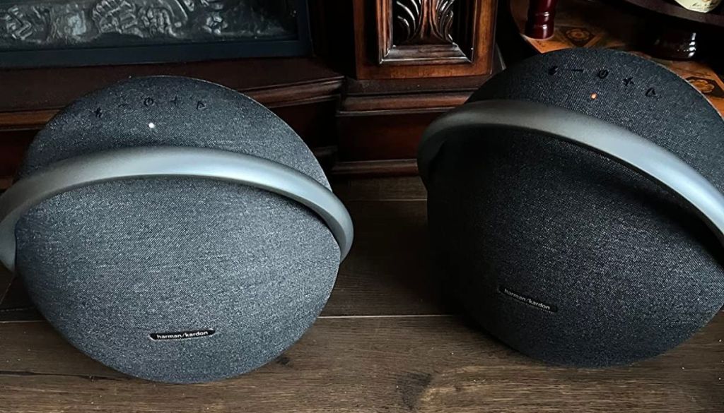 two Harman Kardon Onyx Studio 7 Portable Bluetooth Speakers one gray and one black