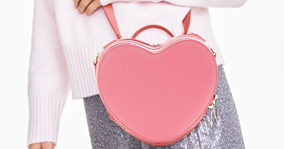 woman with a pink heart crossbody bag