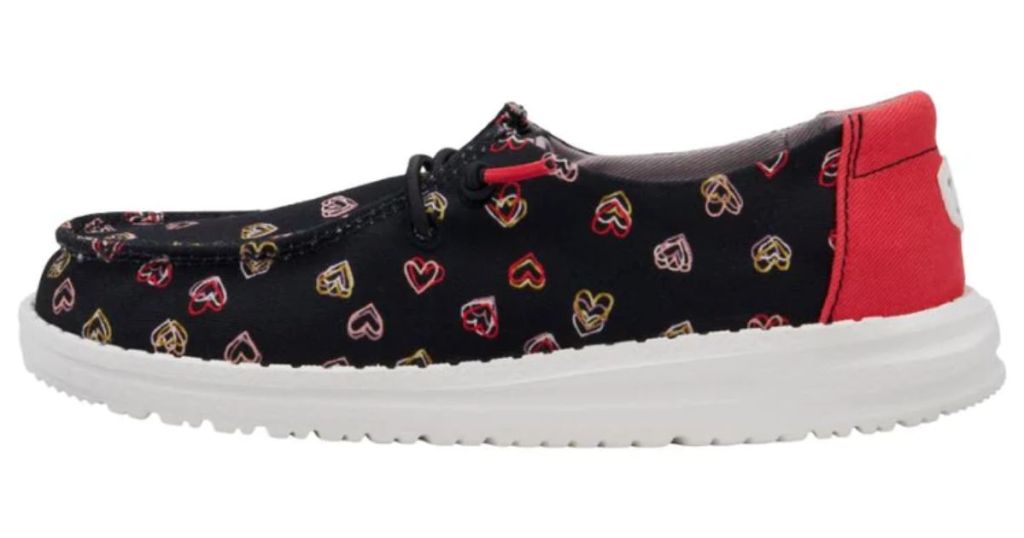 black youth Hey Dude shoe with pink and red double hearts and red laces